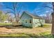 The side of this home has a new, modern green paint job and a small wooden deck attached at 7 Private St, York, SC 29745