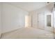 Bedroom featuring neutral walls, carpet floor, interior door and closet at 7124 Bevington Woods Ln, Charlotte, NC 28277