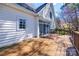 Outdoor wooden deck with white house siding in a pleasant yard at 7124 Bevington Woods Ln, Charlotte, NC 28277