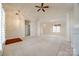 Open concept living room with a fireplace, carpet, and view of the dining area at 7124 Bevington Woods Ln, Charlotte, NC 28277