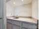 A detailed view of a stylish wet bar featuring modern fixtures at 7124 Bevington Woods Ln, Charlotte, NC 28277