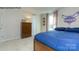 Bedroom featuring sports decor, window with patterned curtains, dresser, and cozy carpet at 7645 Bainbridge Rd, Sherrills Ford, NC 28673