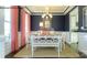 Elegant dining room with coffered ceiling, wainscoting, stylish chandelier, and a view into the kitchen at 7645 Bainbridge Rd, Sherrills Ford, NC 28673