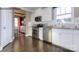 Modern kitchen featuring white cabinets, stainless steel appliances, and a view to the dining area at 7645 Bainbridge Rd, Sherrills Ford, NC 28673