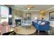 Cozy living room with fireplace, ceiling fan, area rug, and lots of natural light at 7645 Bainbridge Rd, Sherrills Ford, NC 28673