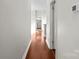 Hallway showcasing gleaming hardwood floors and neutral paint at 792 N Davidson St, Charlotte, NC 28202