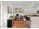 Staged home office and kitchen area with white cabinetry and hardwood floors at 792 N Davidson St, Charlotte, NC 28202