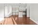 Living room and dining area with hardwood floors and stainless steel appliances at 792 N Davidson St, Charlotte, NC 28202