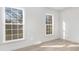 Bedroom with natural light streaming through large windows and light hardwood floors at 8142 Cliffside Dr, Charlotte, NC 28270