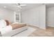 Bedroom featuring light-colored walls and flooring, with double doors and closet at 8142 Cliffside Dr, Charlotte, NC 28270