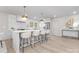 Bright kitchen with breakfast bar, stainless steel appliances, and marble backsplash at 8142 Cliffside Dr, Charlotte, NC 28270