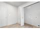 Bright laundry room with white walls, light wood flooring, and washer/dryer hookups at 8142 Cliffside Dr, Charlotte, NC 28270