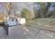 View of the backyard shed with windows, positioned on a well-maintained lot at 8142 Cliffside Dr, Charlotte, NC 28270