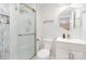 Modern bathroom with a glass-enclosed shower, decorative mirror, and sleek vanity at 9105 Touchstone Ln, Charlotte, NC 28227