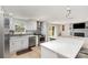 Beautiful kitchen featuring stainless appliances, quartz countertops, and open layout to living area at 9105 Touchstone Ln, Charlotte, NC 28227