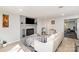 Comfortable living room features a fireplace, TV, neutral color scheme, and contemporary furnishings at 9105 Touchstone Ln, Charlotte, NC 28227