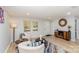 Inviting living room showcasing a large window, modern furnishings, and open layout at 9105 Touchstone Ln, Charlotte, NC 28227