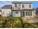 Exterior rear view of a two story home featuring a patio and grassy area at 9832 Veronica Dr, Charlotte, NC 28215