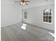 Bright bedroom featuring two windows and carpet floors at 9832 Veronica Dr, Charlotte, NC 28215