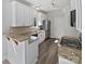 Well-lit kitchen featuring granite countertops, stainless steel appliances, and ample cabinet space at 9832 Veronica Dr, Charlotte, NC 28215