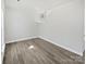 Bright empty room with modern hardwood flooring, ready for your design at 9832 Veronica Dr, Charlotte, NC 28215