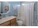 Charming bathroom with a shower-tub combo, decorative accents, and soothing blue walls at 10005 Chimney Dr, Waxhaw, NC 28173
