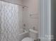 Bathroom with a toilet and a tub with shower curtain at 10005 Chimney Dr, Waxhaw, NC 28173
