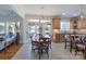 Eat-in kitchen featuring a breakfast nook, stainless steel appliances, and a view of the backyard at 10005 Chimney Dr, Waxhaw, NC 28173