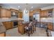 Spacious kitchen with wooden cabinets, stainless steel appliances, and granite countertops on island at 10005 Chimney Dr, Waxhaw, NC 28173
