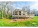 Backyard view of a home with decks and grassy area at 1001 Churchill Downs Ct # A, Charlotte, NC 28211