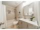 Bathroom featuring tile, modern fixtures, and decorative orchid at 1001 Churchill Downs Ct # A, Charlotte, NC 28211