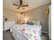 Bedroom features a ceiling fan, plush bedding, and a neutral color scheme at 1001 Churchill Downs Ct # A, Charlotte, NC 28211