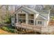 Inviting condo building with large wooden walkways and covered balconies in a wooded setting at 1001 Churchill Downs Ct # A, Charlotte, NC 28211