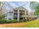 Multi-level home exterior featuring spacious decks and beautiful landscaping at 1001 Churchill Downs Ct # A, Charlotte, NC 28211
