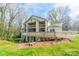 Exterior of home featuring expansive decks and well-maintained grounds at 1001 Churchill Downs Ct # A, Charlotte, NC 28211