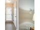 Hallway with light gray walls and wood flooring and front door at 1001 Churchill Downs Ct # A, Charlotte, NC 28211