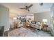 Bright living room with hardwood floors, ceiling fan, and views to the kitchen, creating a cozy space at 1001 Churchill Downs Ct # A, Charlotte, NC 28211