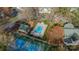 Overhead shot of community pool, tennis court and buildings with well-kept landscaping at 1001 Churchill Downs Ct # A, Charlotte, NC 28211