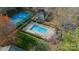 Aerial shot of the sparkling pool and tennis courts in a well-maintained community at 1001 Churchill Downs Ct # A, Charlotte, NC 28211