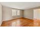 Bedroom with hardwood floors, neutral walls, window with natural light and ample space at 103 S Laurel Ave, Charlotte, NC 28207
