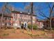 Exterior view of a three story brick building with stairs leading to front door at 103 S Laurel Ave, Charlotte, NC 28207
