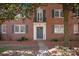 Charming brick building featuring a classic front door entrance and Juliet balcony at 103 S Laurel Ave, Charlotte, NC 28207