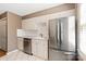 Updated kitchen featuring stainless steel appliances, white cabinets and tile flooring at 103 S Laurel Ave, Charlotte, NC 28207