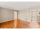 Spacious living room with hardwood floors and neutral wall paint at 103 S Laurel Ave, Charlotte, NC 28207
