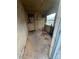 Enclosed porch with lots of natural light from the window and exterior door at 1128 Rosehill Dr, Lincolnton, NC 28092