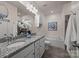 Bathroom featuring granite dual sink vanity and soaking tub at 11332 Westbranch Pkwy, Davidson, NC 28036