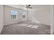 Bedroom with two windows and built-in shelving at 11332 Westbranch Pkwy, Davidson, NC 28036