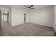 Large bedroom with neutral walls and plush carpet at 11332 Westbranch Pkwy, Davidson, NC 28036