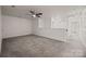 Spacious bonus room with neutral carpet and white walls, perfect for entertaining at 11332 Westbranch Pkwy, Davidson, NC 28036