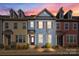 Charming townhome featuring a colorful facade, landscaped front yard, and a welcoming entrance at 11332 Westbranch Pkwy, Davidson, NC 28036